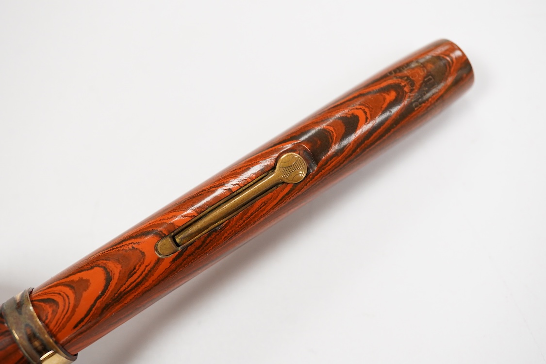 A Waterman Red Ripple No.7 lever filler with yellow cap band and fitted with a Waterman nib